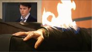 Michael's arm on fire with a close-up of him inset. | Image Source: YouTube