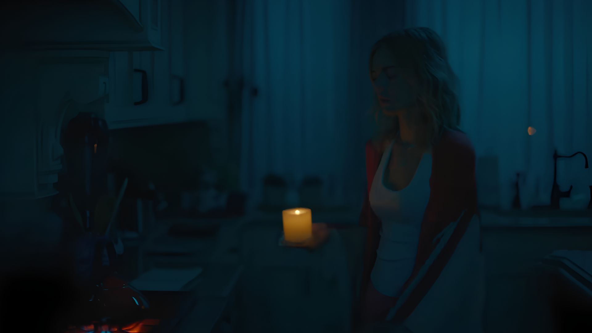 Samara Weaving holding a candle in Borderline
