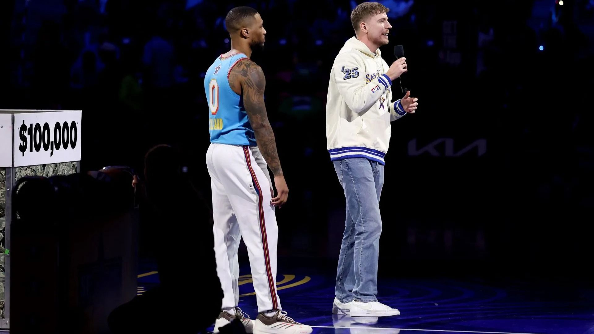 Mr. Beast announces a half court shot with Damian Lillard #0 of the Milwaukee Bucks and Shaq