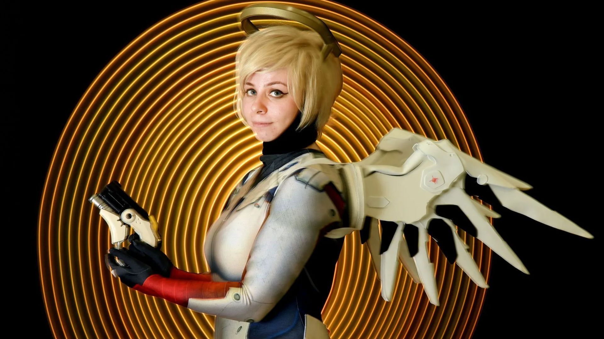 Cosplayer playing Mercy from Overwatch 2 in 2018 New York Comic Con Portraits - Source: Getty