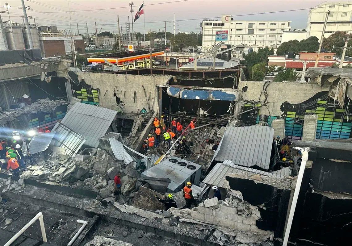 Image of the destruction caused by roof cave-in at the Jet Set Club in Santa Domingo. Image via X @TheRioTimes