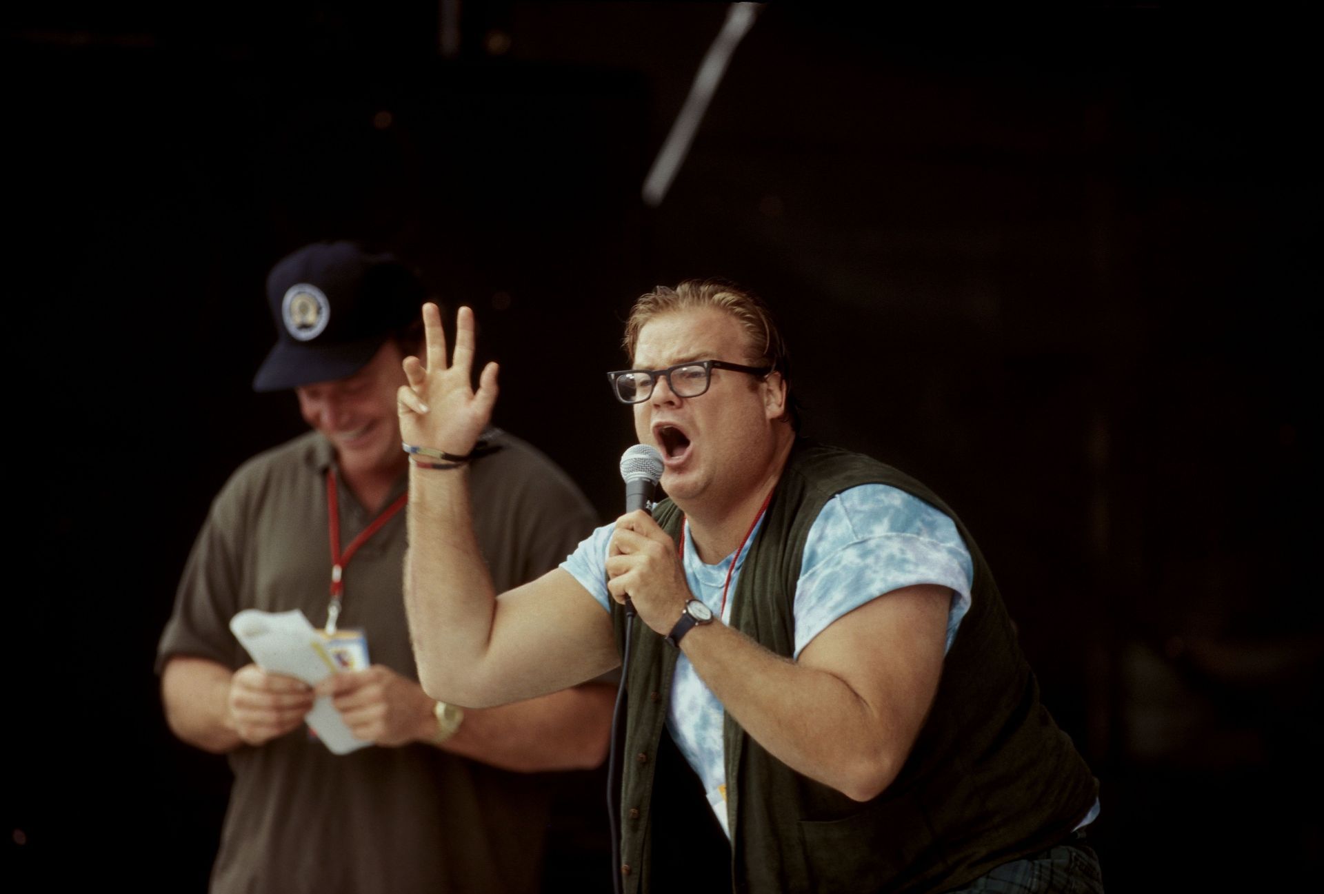 Tom Arnold And Chris Farley On Stage At Woodstock 94. - Source: Getty