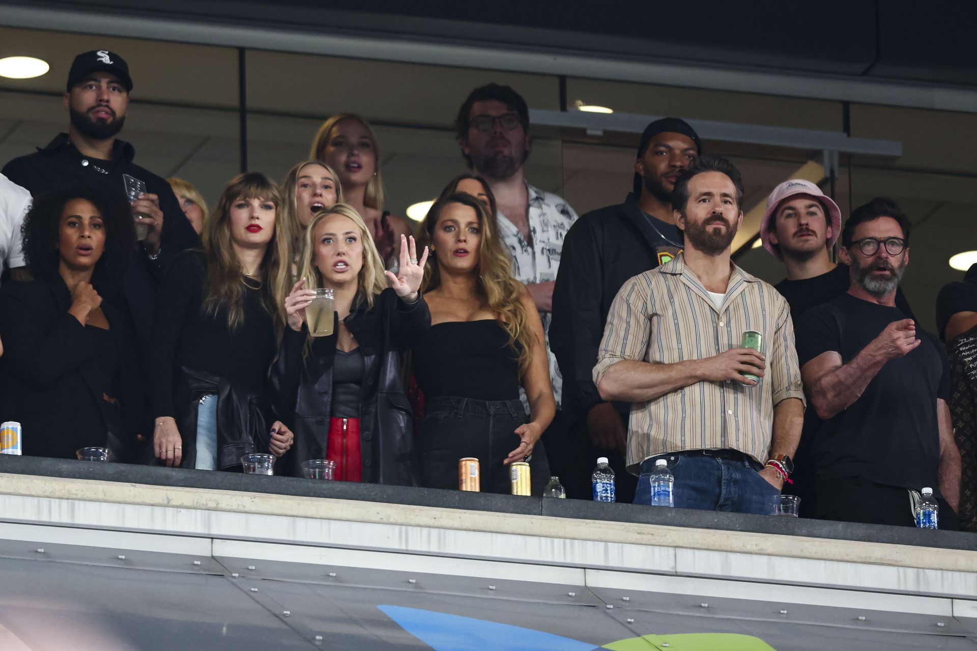 [L-R] Taylor Swift, Brittany Mahomes, Blake Lively, Ryan Reynolds, and Hugh Jackman during a Jets-Chiefs game in 2023 (Image via Kevin Sabitus/Getty Images)