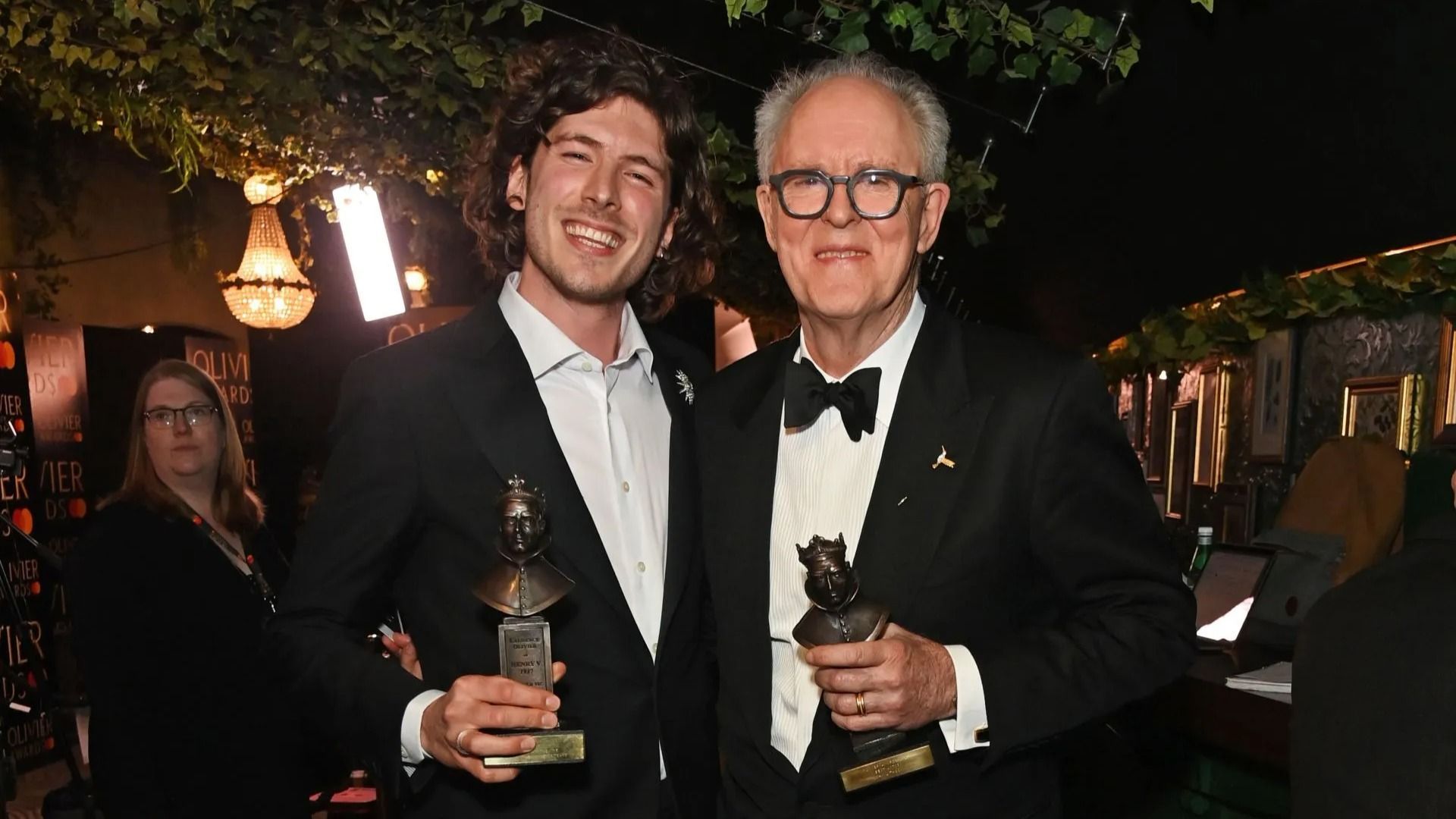 Sam Grabiner and John Lithgow pose backstage at The Olivier Awards 2025 - Source: Getty