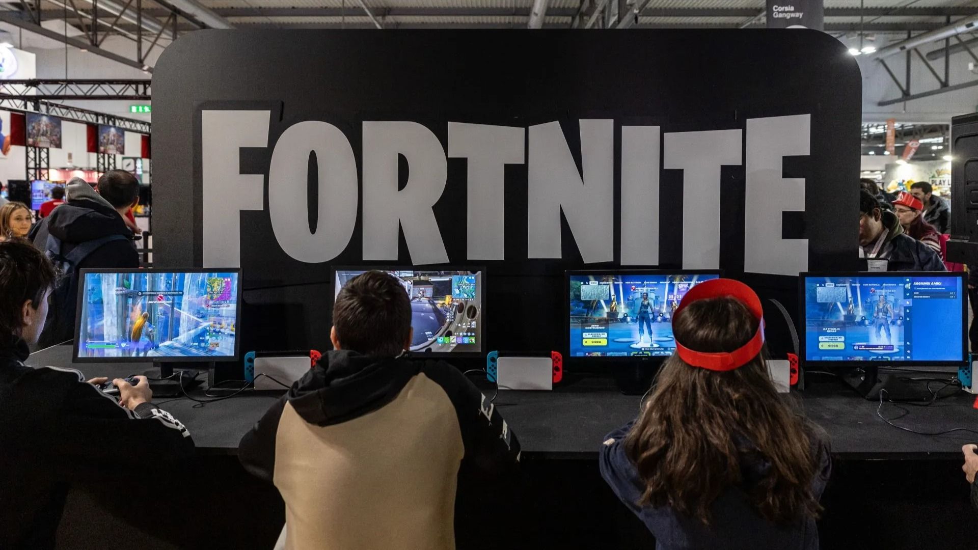 Fairgoers play Fortnite at the Japanese publisher Nintendo Switch