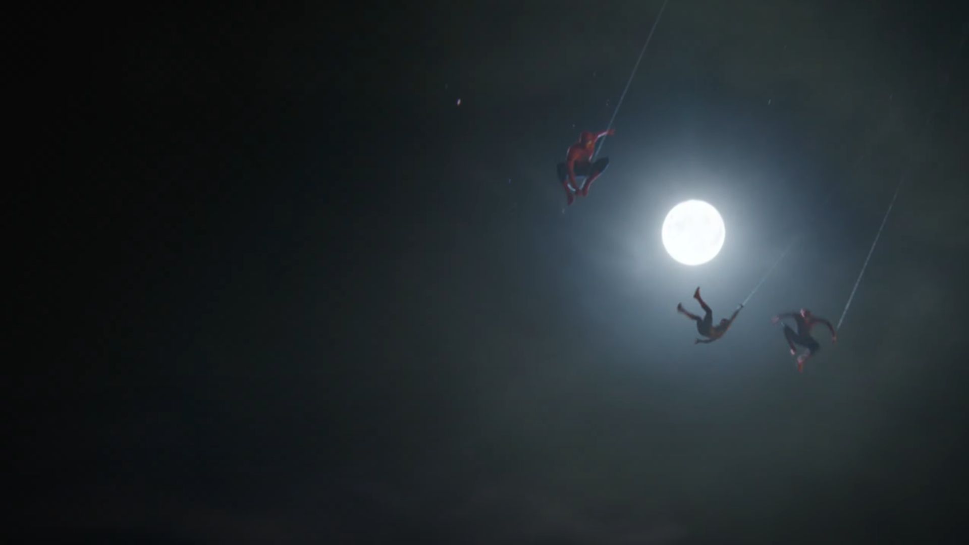 Spider-Men swinging in the night