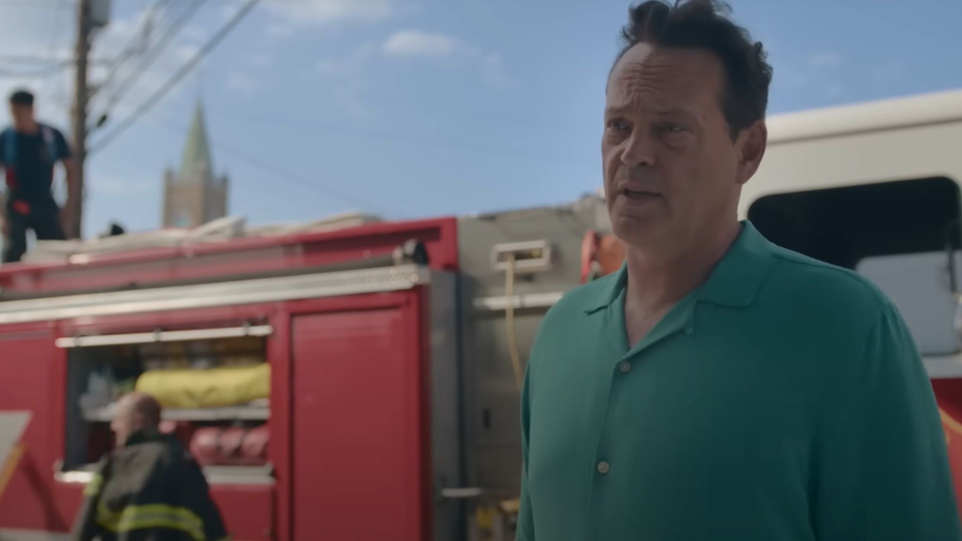 Vince Vaughn standing in front of a fire truck