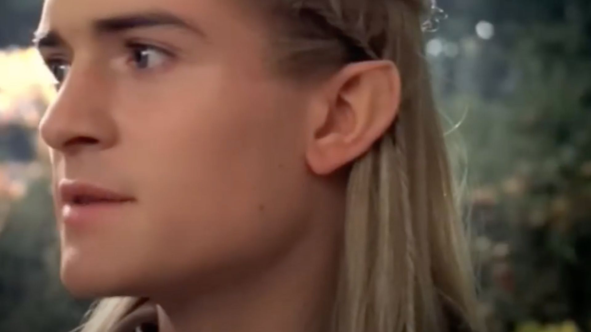 This is a close up still of Orlando Bloom as Legolas in 