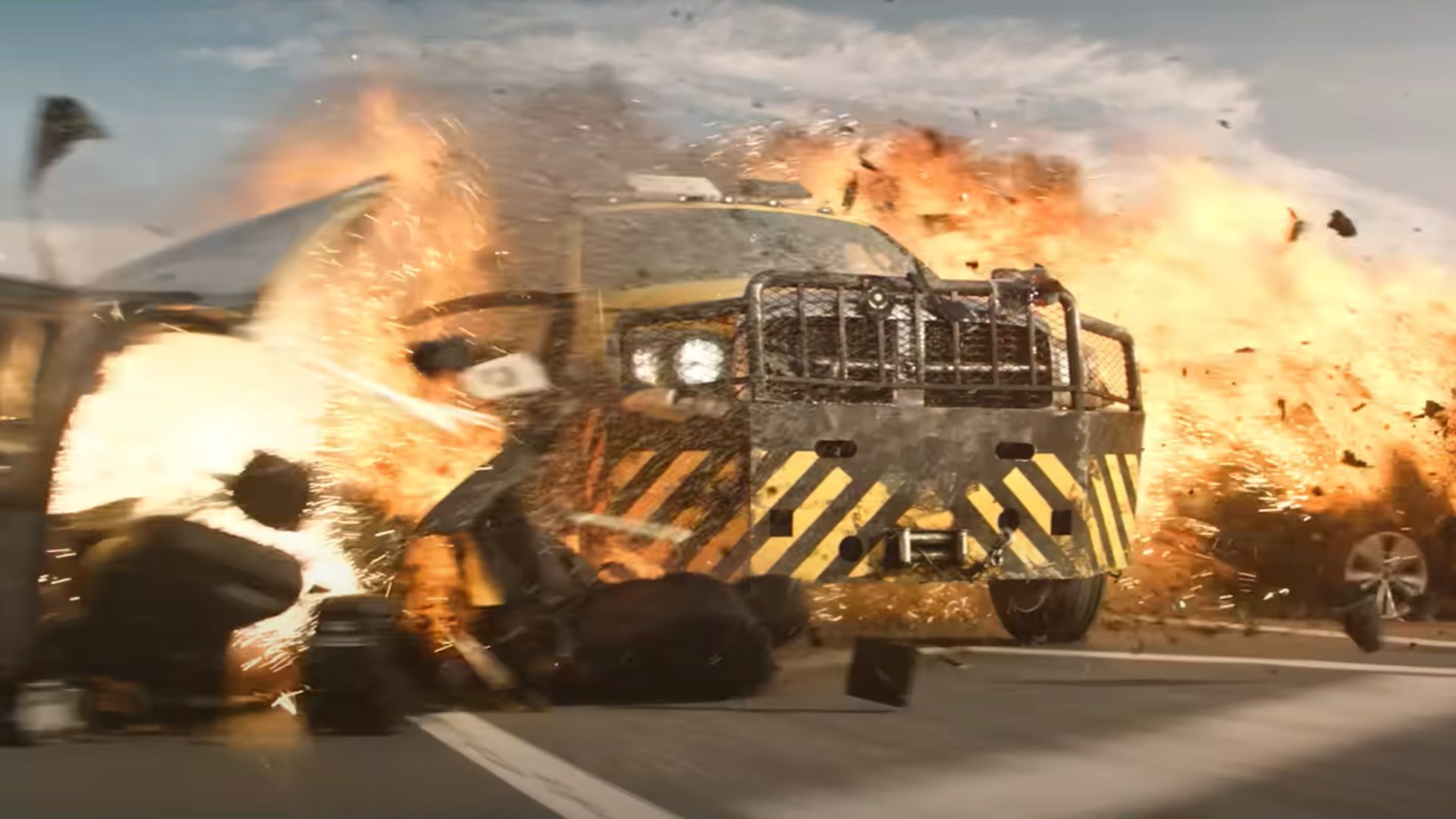 A heavy vehicle destroys a roadblock