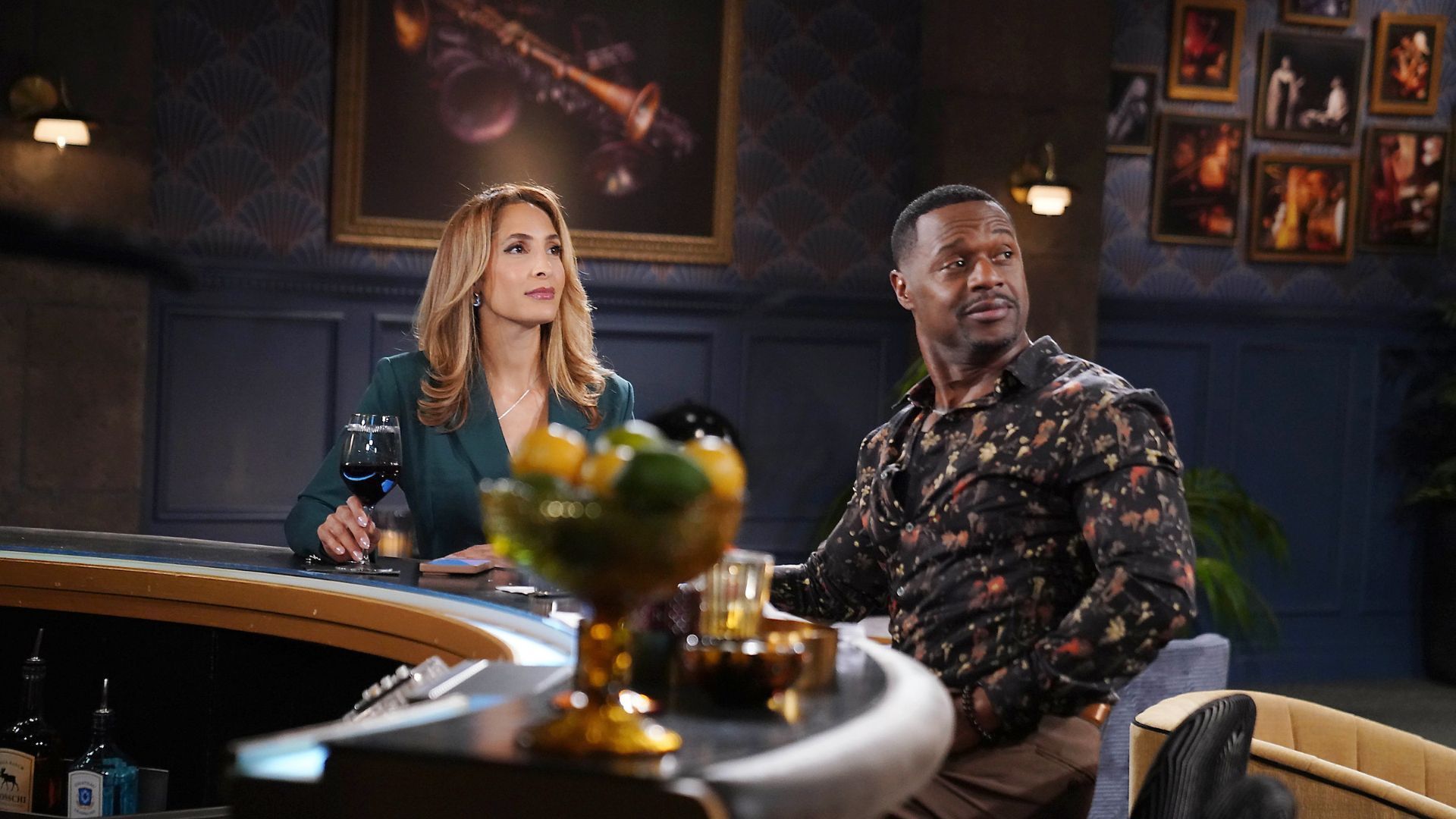 Damian and Lily look at Neil&#039;s portrait on the wall | Image: JPI