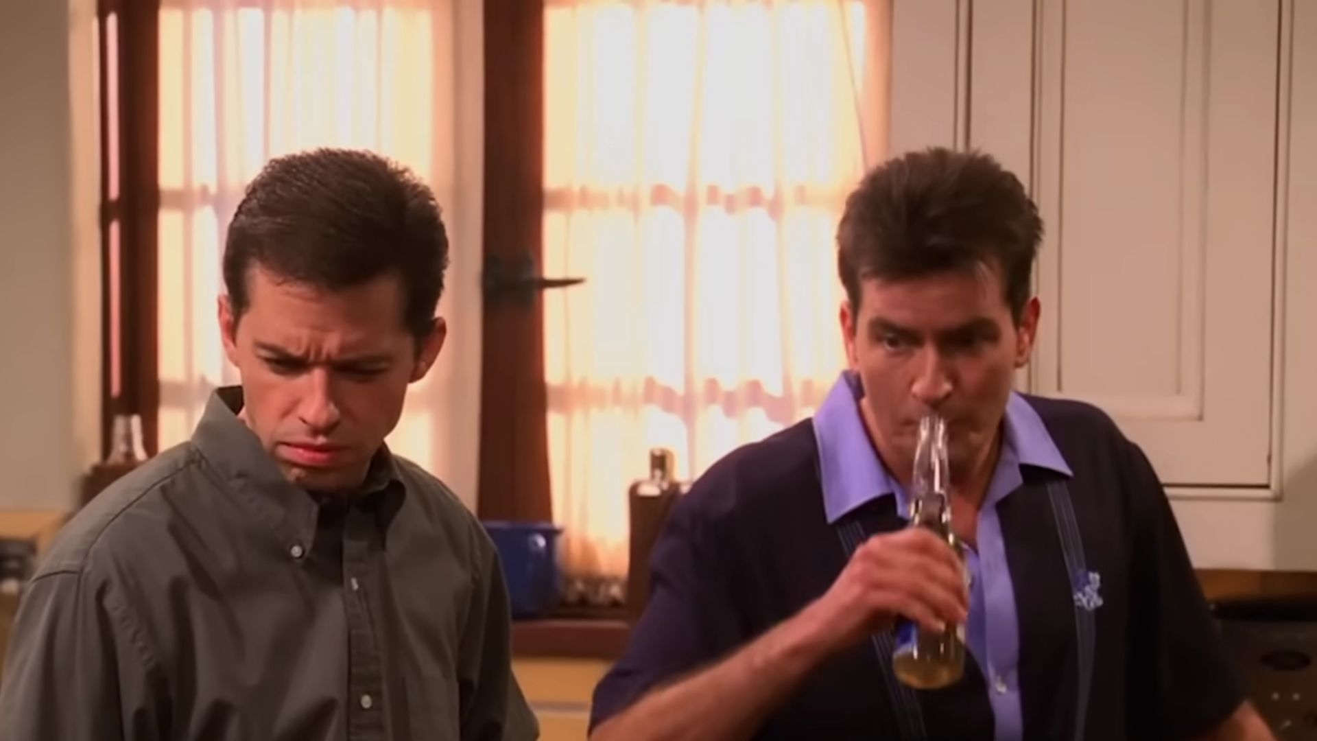 Still from Two and a Half Men (Screenshot from Supercut: More Great Moments from Season 1!/ Two and a Half Men on YouTube)