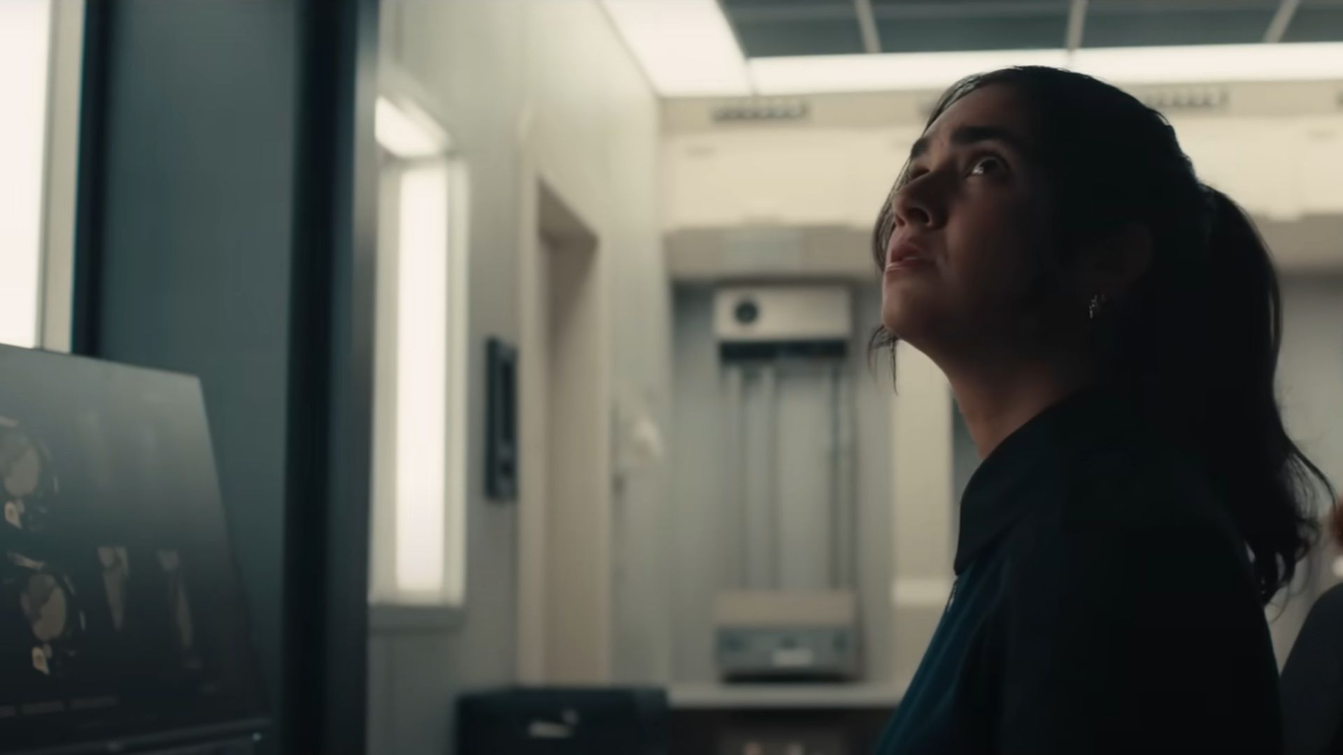 Mel looks up at fluctuating lights in the Avengers tower