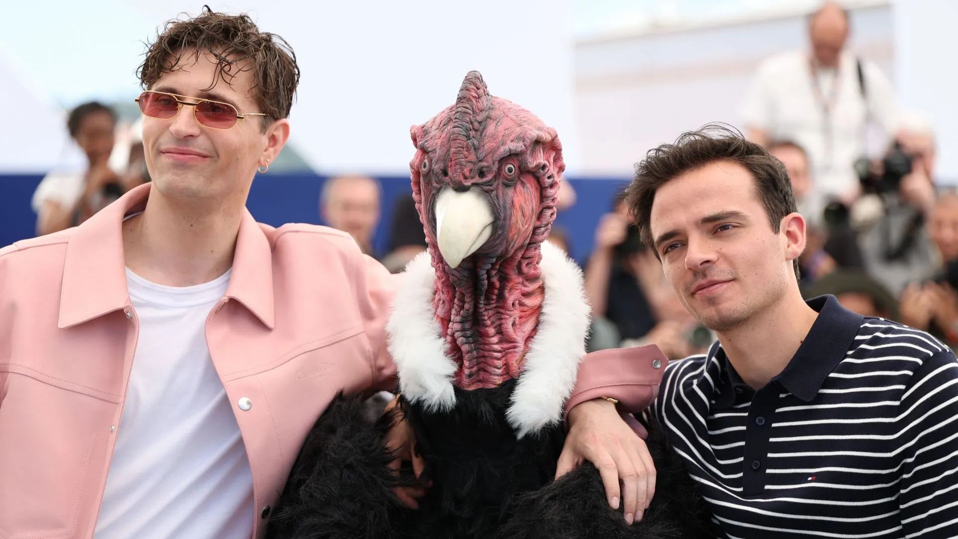Raphael Quenard, Hugo David, and a man dressed as a condor (Getty via Soap Central CMS - Resized on Canva)