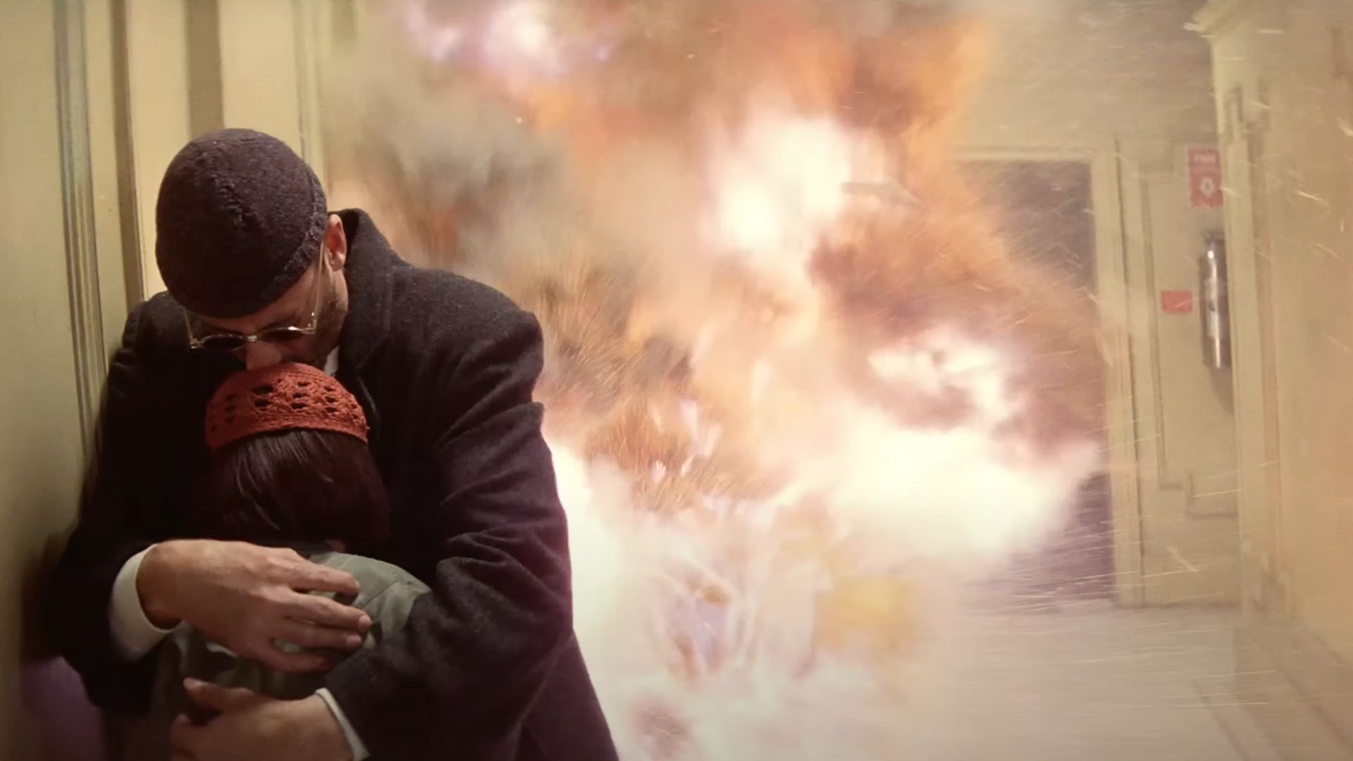 Leon covers Mathilda to save her from being impacted by grenade