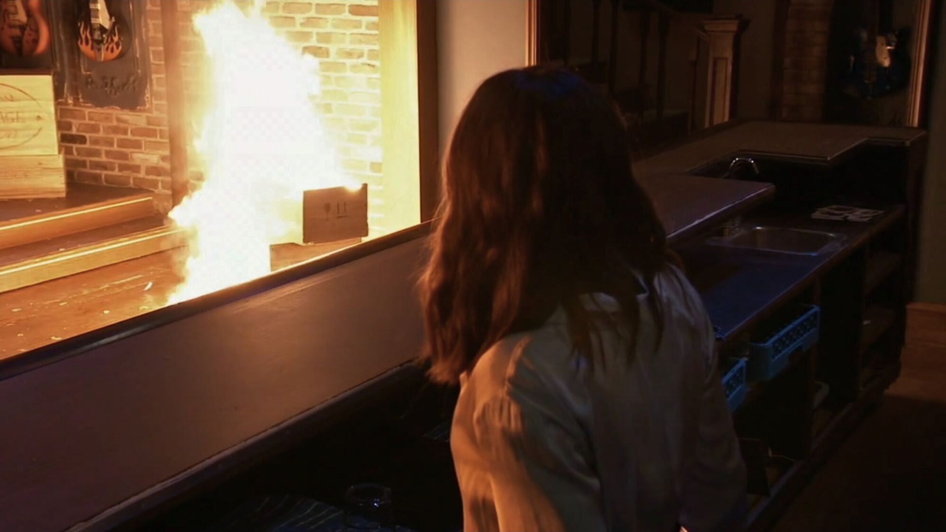 Unknown, masked men start a fire at Charlie&#039;s while Kristina is inside on General Hospital | Image: ABC