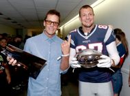 Tom Brady and Rob Gronkowski at the Fanatics Fest with the broken trophy (Image via Getty)