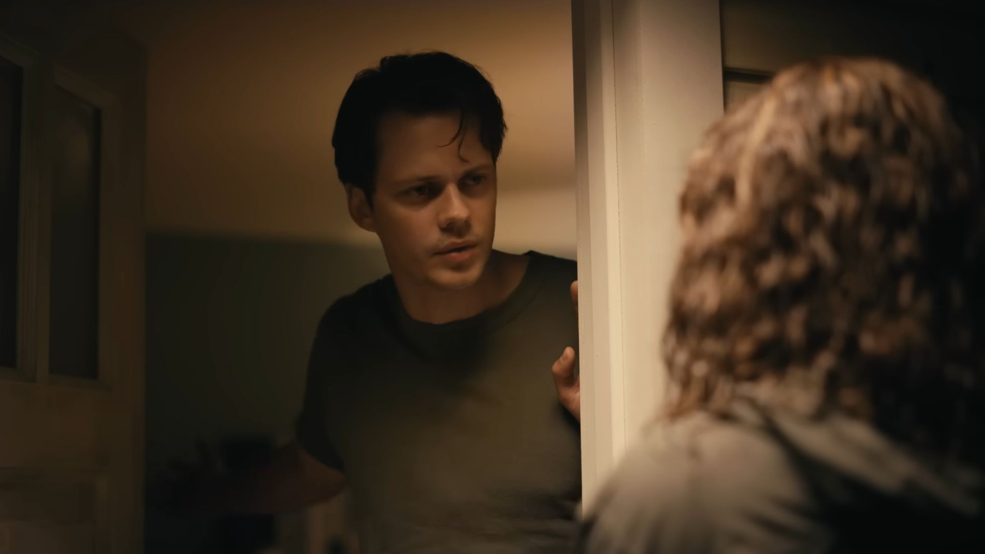 Bill Skarsgard talking to a woman