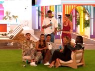 Emily with her friends. Image via Youtube/@LoveIsland