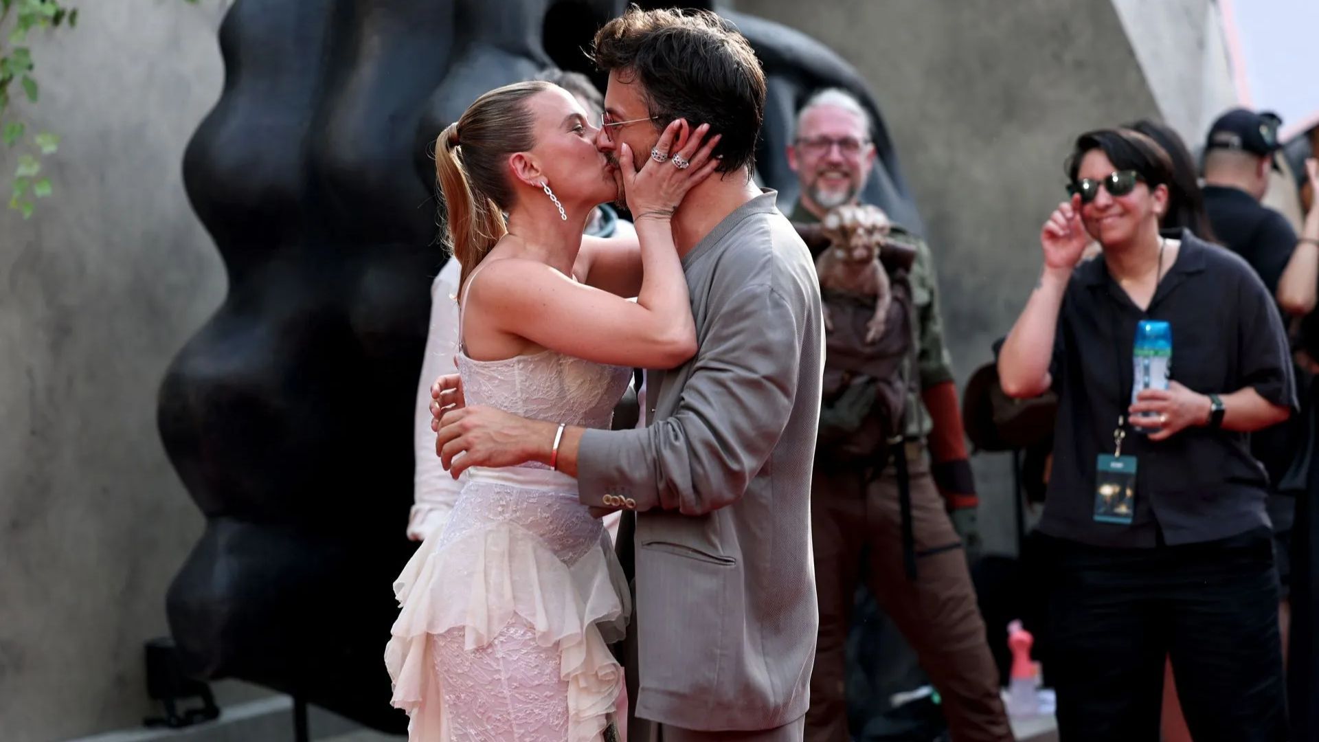 Jonathan Bailey and Scarlett Johansson share a kiss at the New York premiere of their film, Jurassic World Rebirth (Getty via Soap Central CMS - Resized on Canva)
