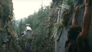 John Rambo is seen hanging from a cliff. (Image via Carolco Pictures)