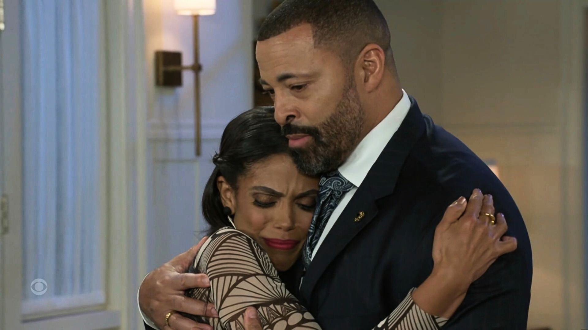 Beyond the Gates: Dani Dupree and Bill Hamilton comfort each other in the wake of their daughters kidnapping | Image: CBS