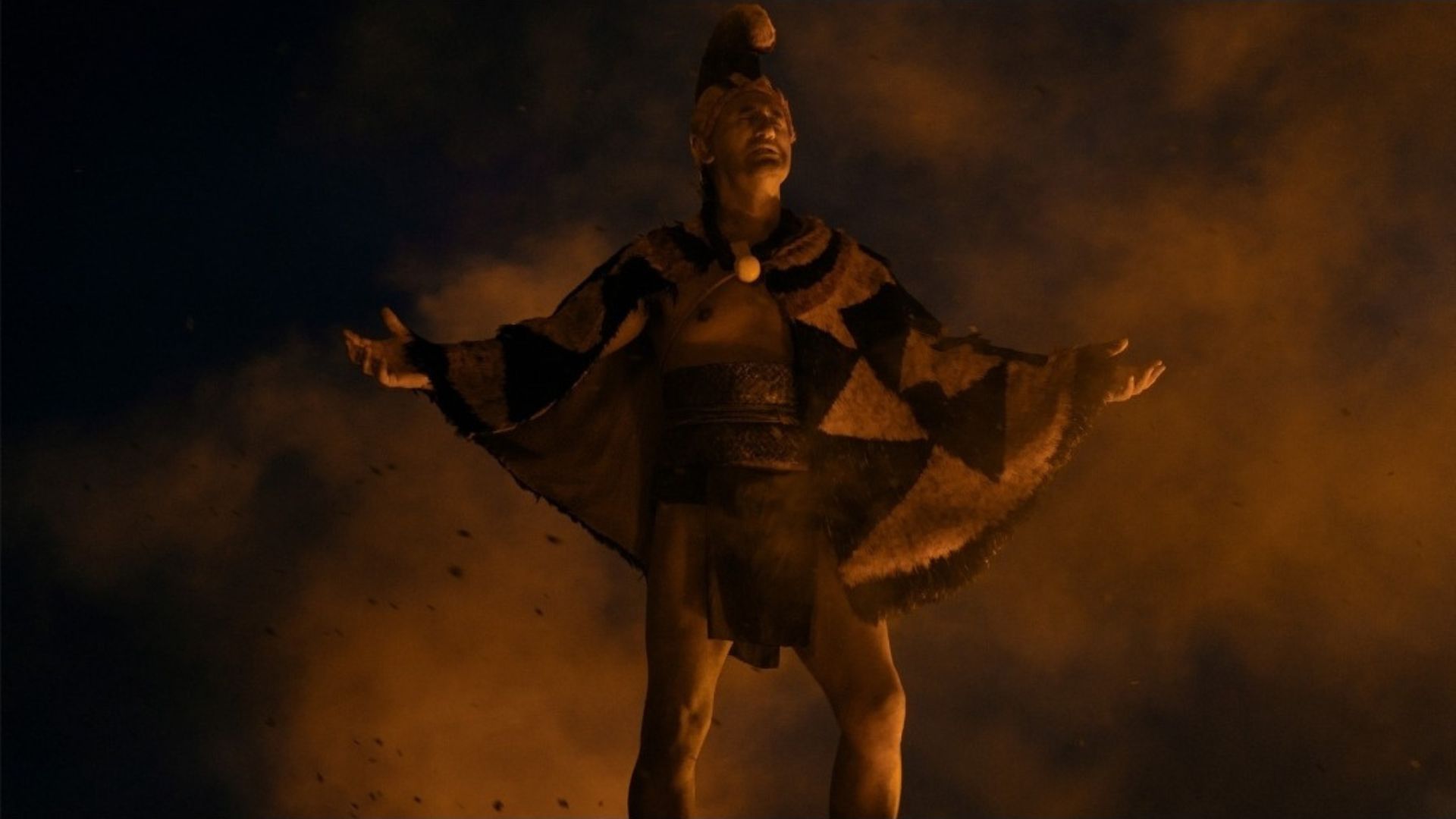 In Chief of War Episode 9, Keoua asks a chief to knock his teeth to prove his loyalty to him (Image Via AppleTV+)