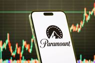 Paramount Global logo on smartphone with stock market chart background - Source: Getty