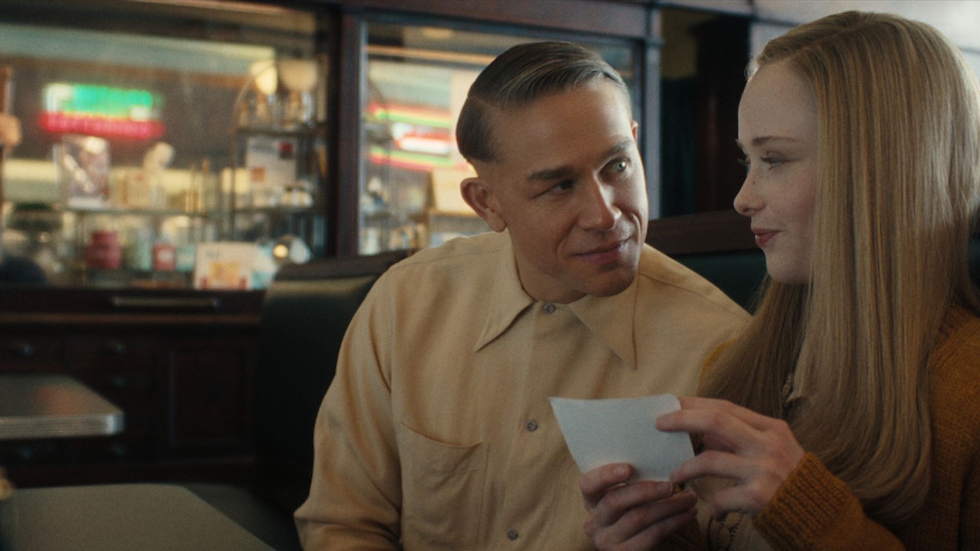 Charlie Hunnam as Ed Gein and Addison Rae as Evelyn for Monster: The Ed Gein Story (Image via Netflix)