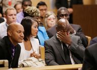 Adrian Peterson and Ashley Brown at Peterson's child abuse case hearing in 2014 (Image via Getty)