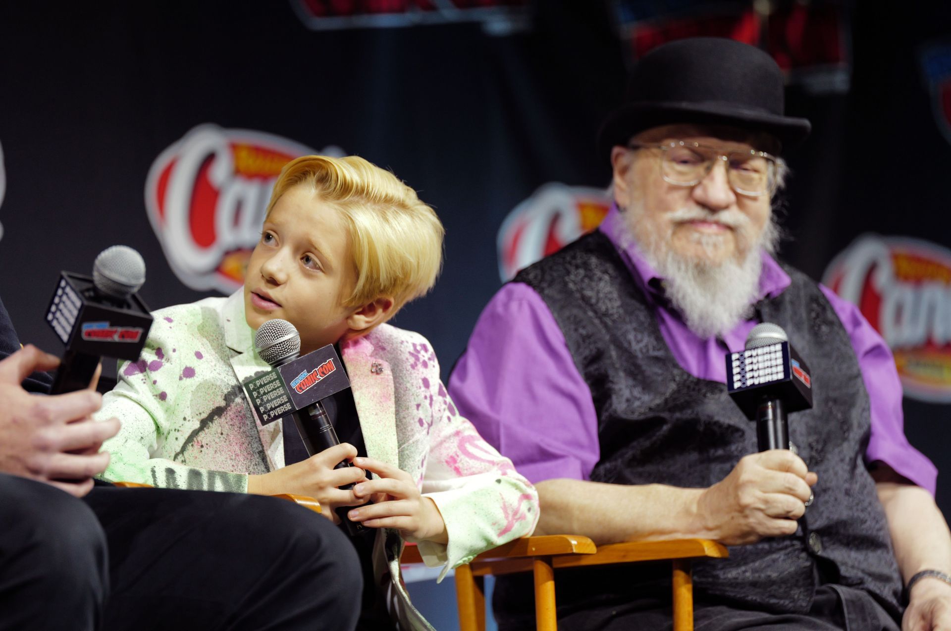 Dexter Sol Ansell and George R.R. Martin speak at HBO / HBO Max presents A Knight of the Seven Kingdoms &ndash; Journey into Westeros with Dunk and Egg during New York Comic Con 2025 at The Jacob K. Javits Convention Center on October 09, 2025 in New York City | Image via: Getty