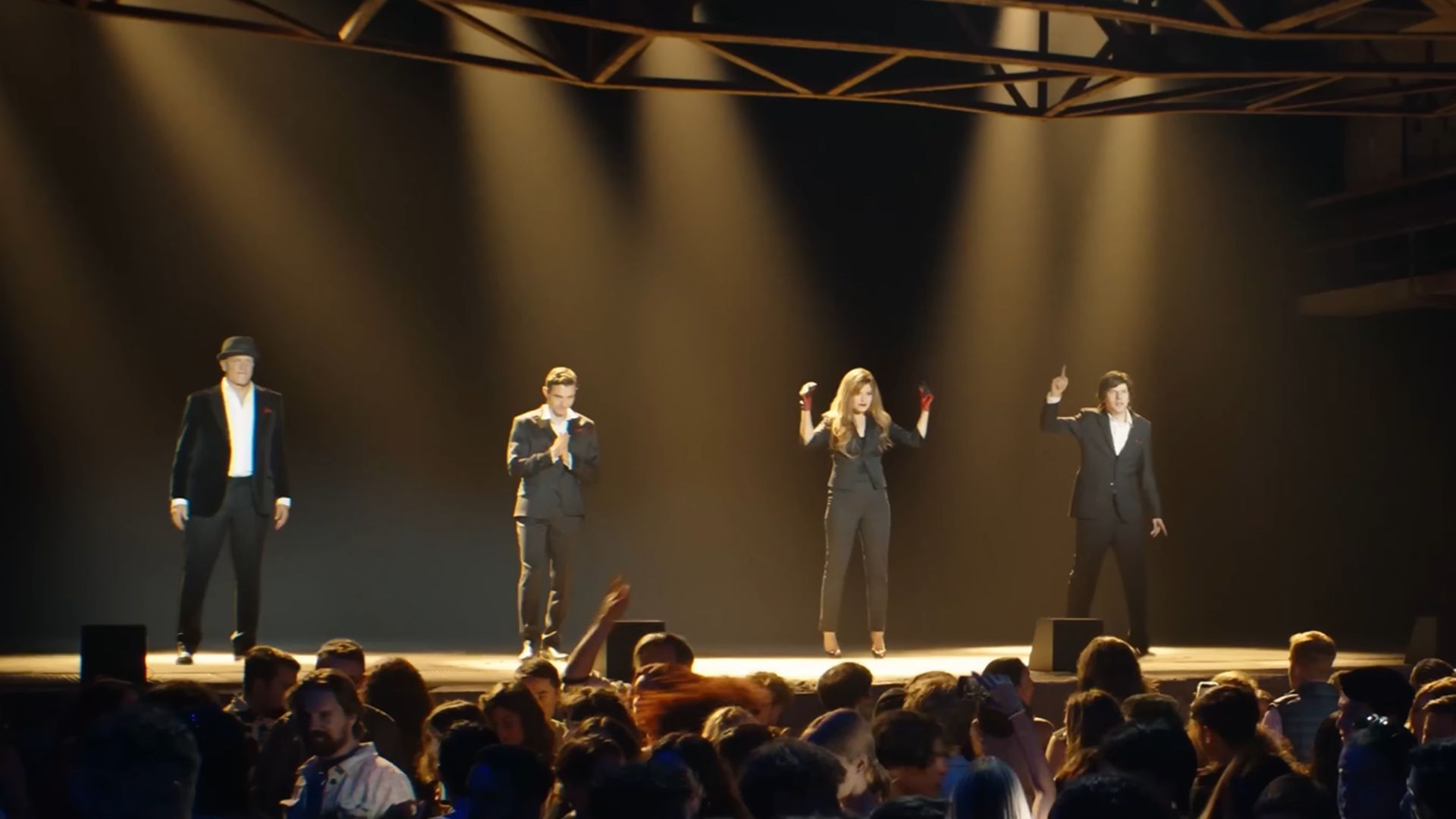 The Four Horsemen are seen on a stage