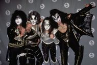 Ace Frehley (second from right) flanked by bandmates (L-R) Paul Stanley, Peter Criss, and Gene Simmons in 1996 (Image via Getty)