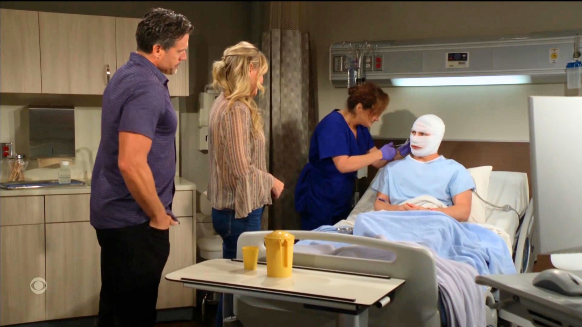 Nick and Sharon watch as a nurse removes Noah&#039;s bandages on The Young and the Restless | Image: CBS