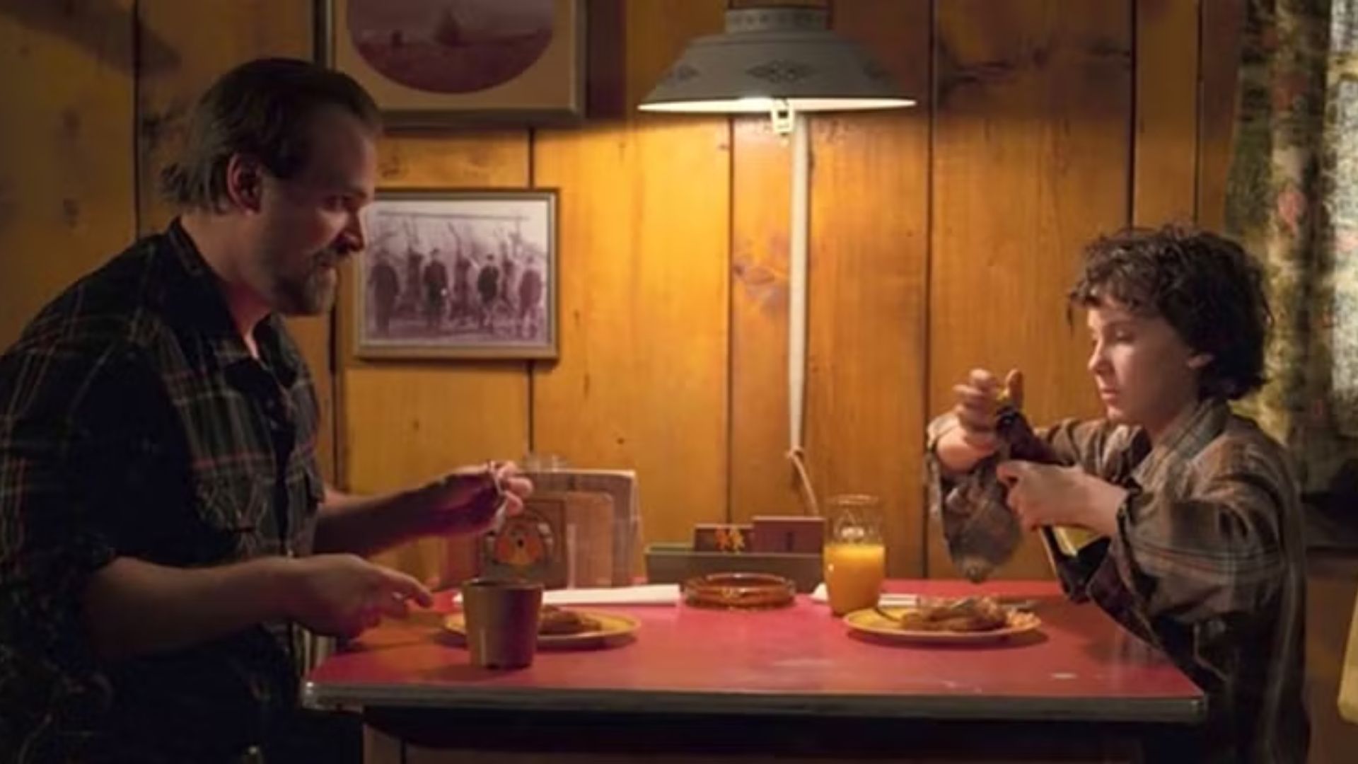 Hopper &amp; Eleven enjoying their breakfast at his cabin in Stranger Things Season 1 | Image via Netflix